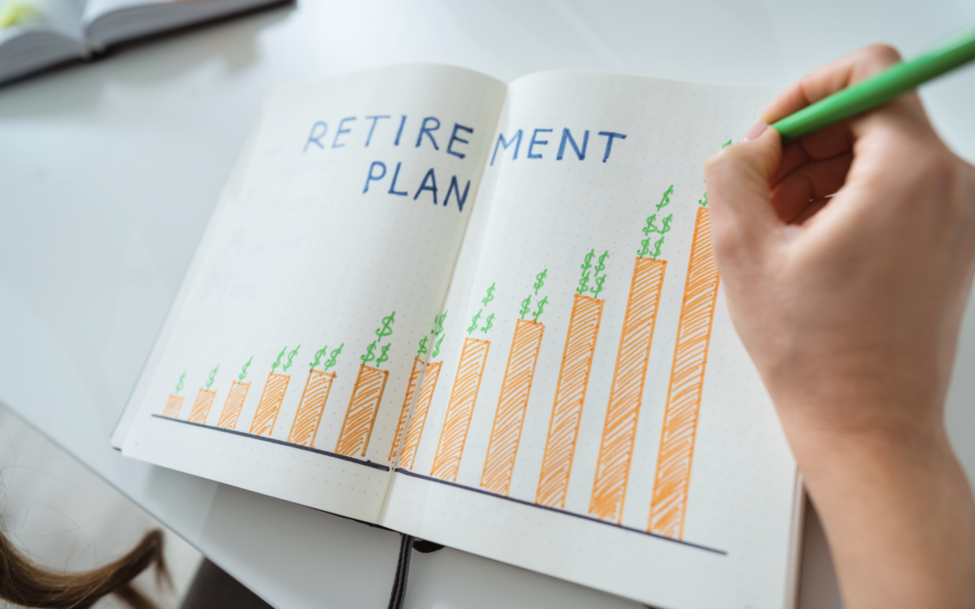 Human hand drawing retirement plan growth concept