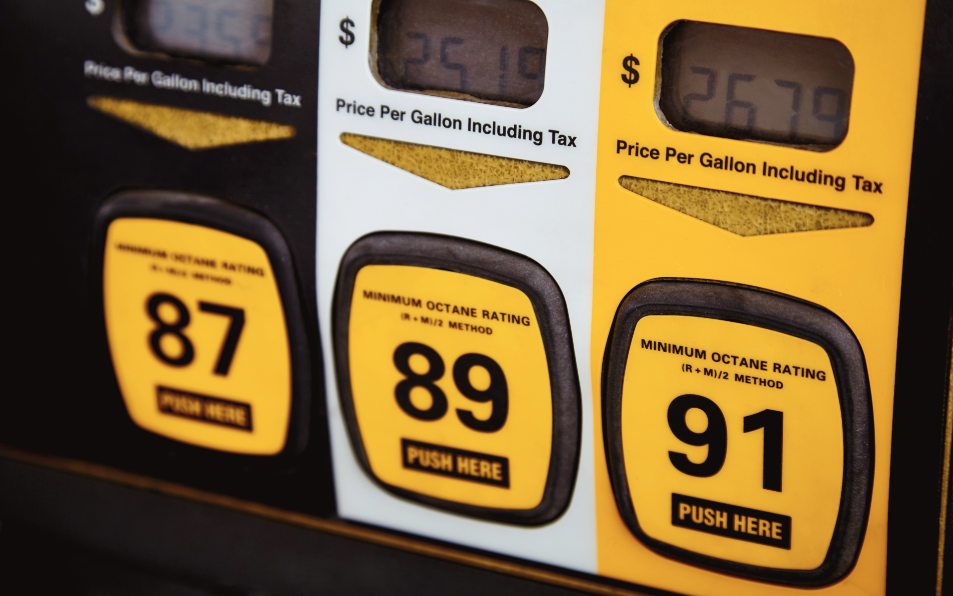 Close-up of a gas pump interface showing three fuel options.